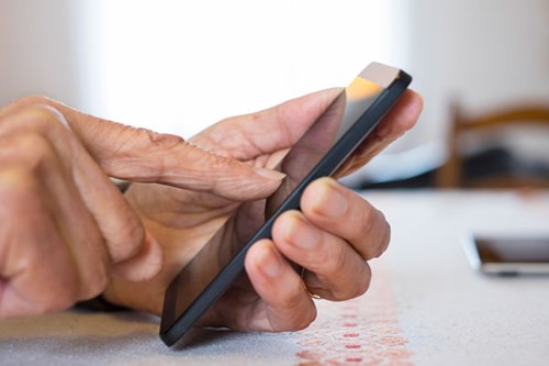 senior using mobile phone