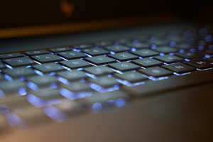 closeup of hands on a computer keyboard